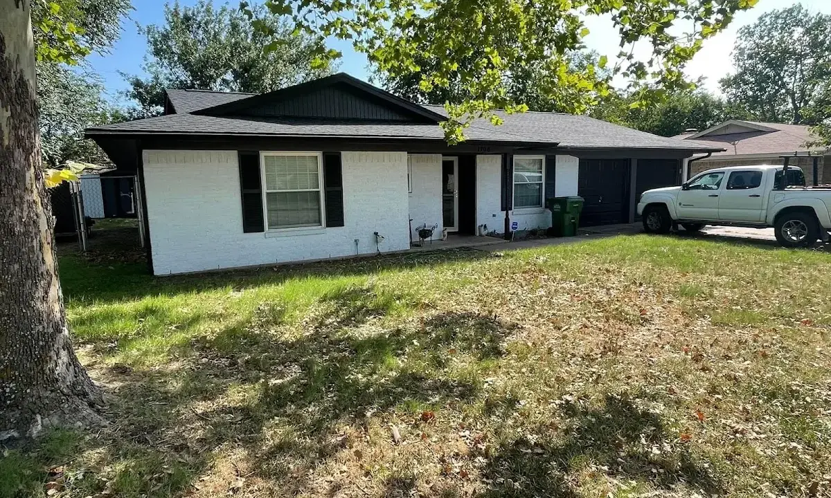 Professional roofing crew working on a residential roof in Reedurban